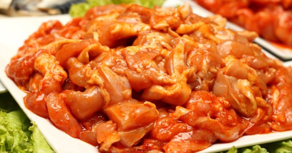 Raw marinated chicken