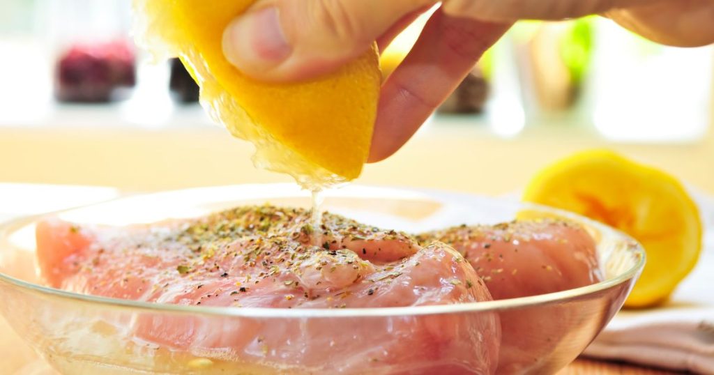 Raw chicken breasts marinating