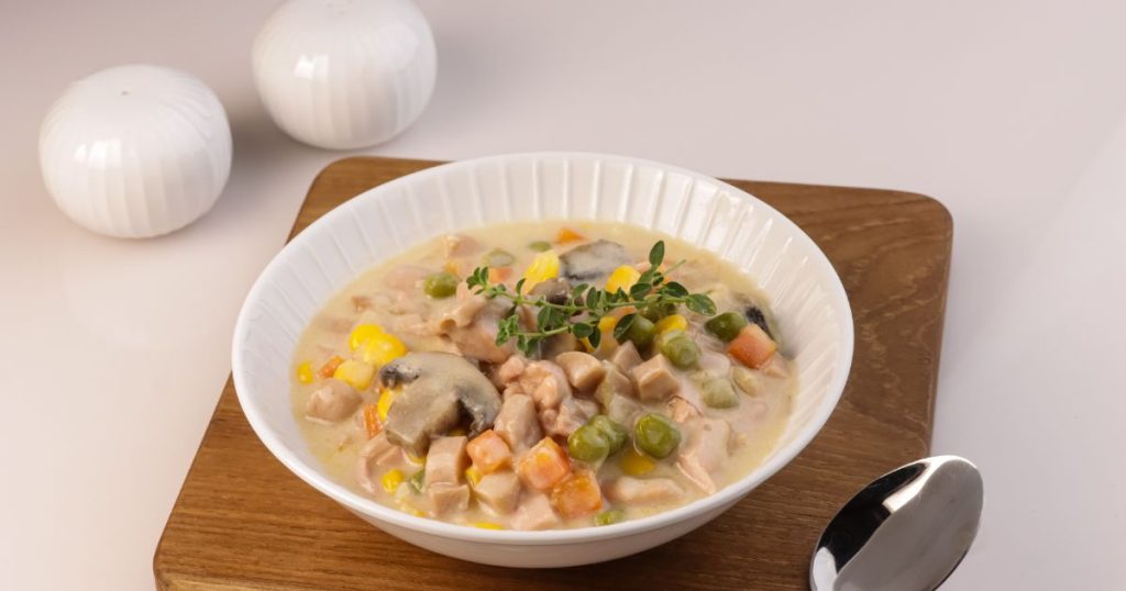 Sup krim ayam is a bowl of creamy chicken and vegetable soup