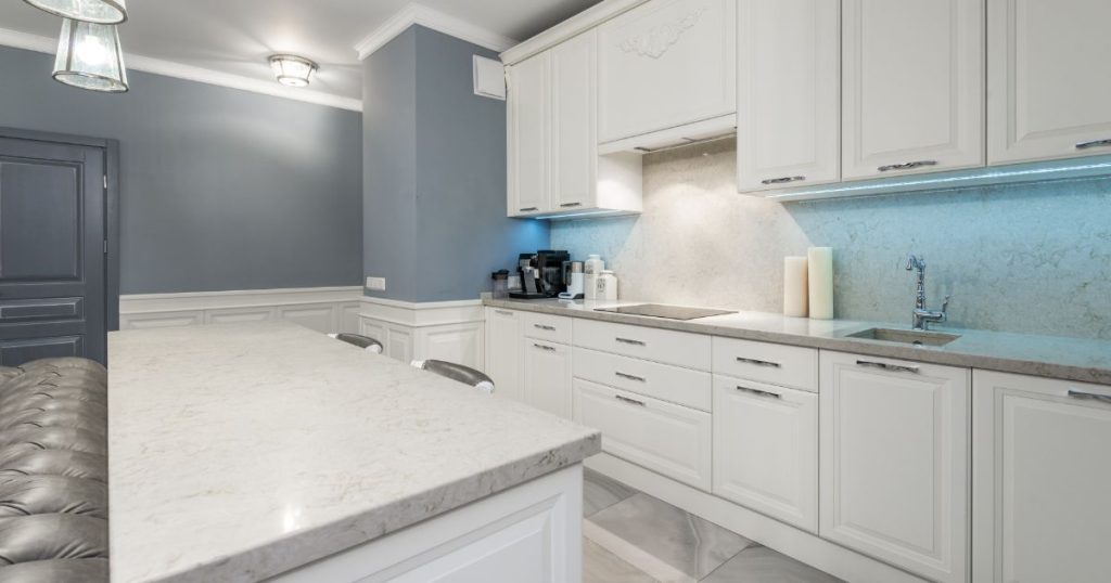 A White Kitchen Cabinets with White Granite Countertops