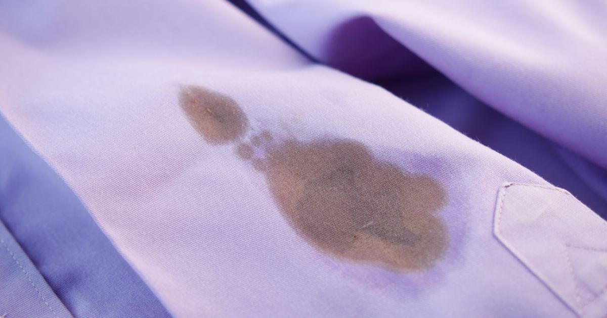 oil stain on purple color cloth